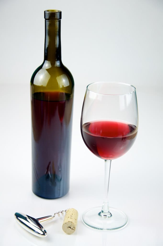 glass_of_red_wine_with_a_bottle_of_red_wine_-_evan_swigart